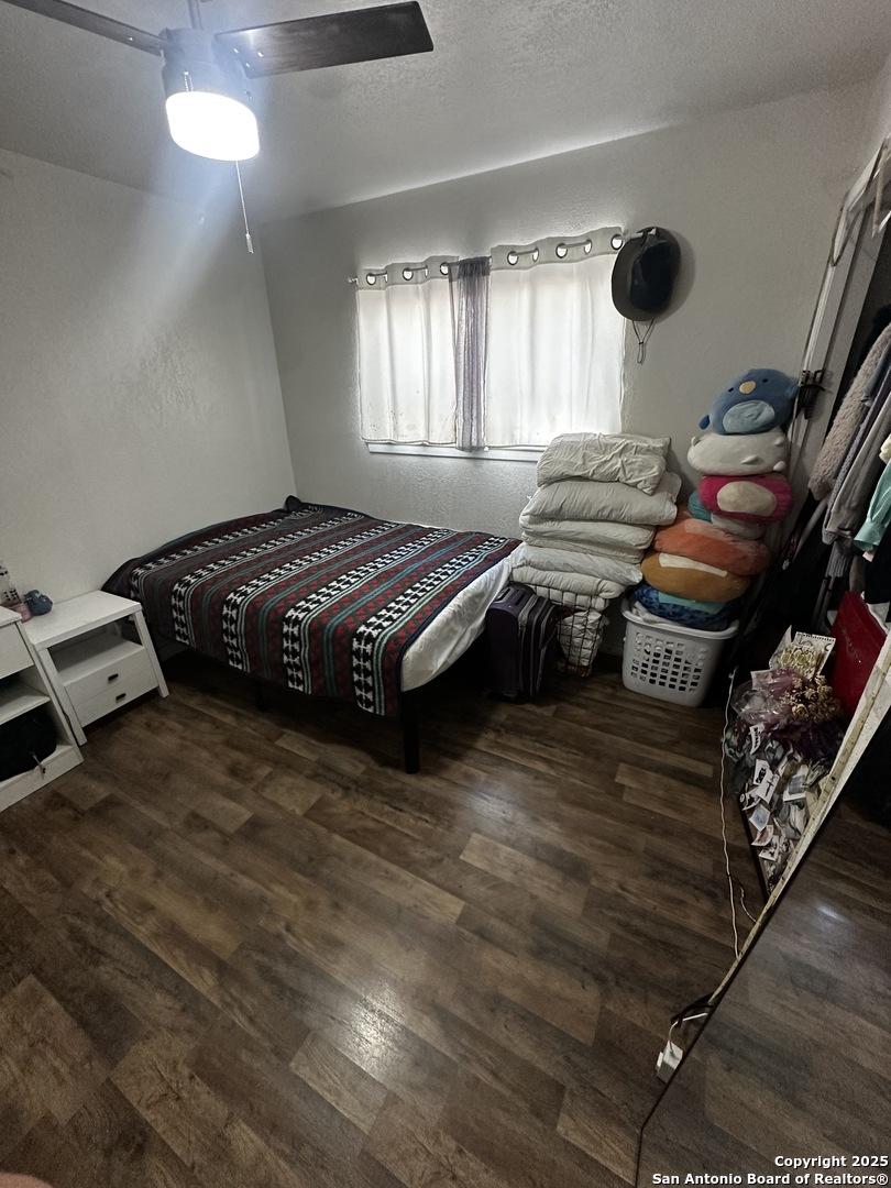 5910 Rimkus Drive Leon Valley, TX 78238 - Photo 9 of 10 a spacious bedroom with a bed and window