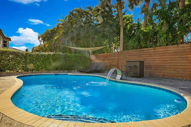a view of a swimming pool with a patio