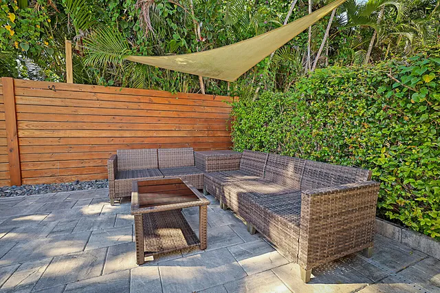 a view of a roof deck with wooden floor and fence