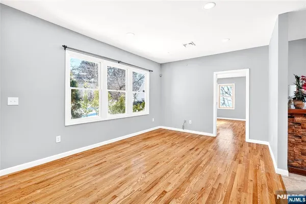 a view of a room with wooden floor and stairs