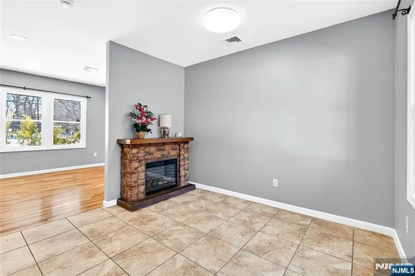 a view of kitchen with cabinets and window