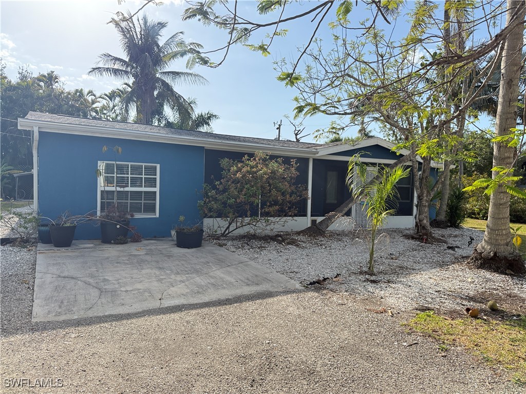 a view of a house with a yard and garage