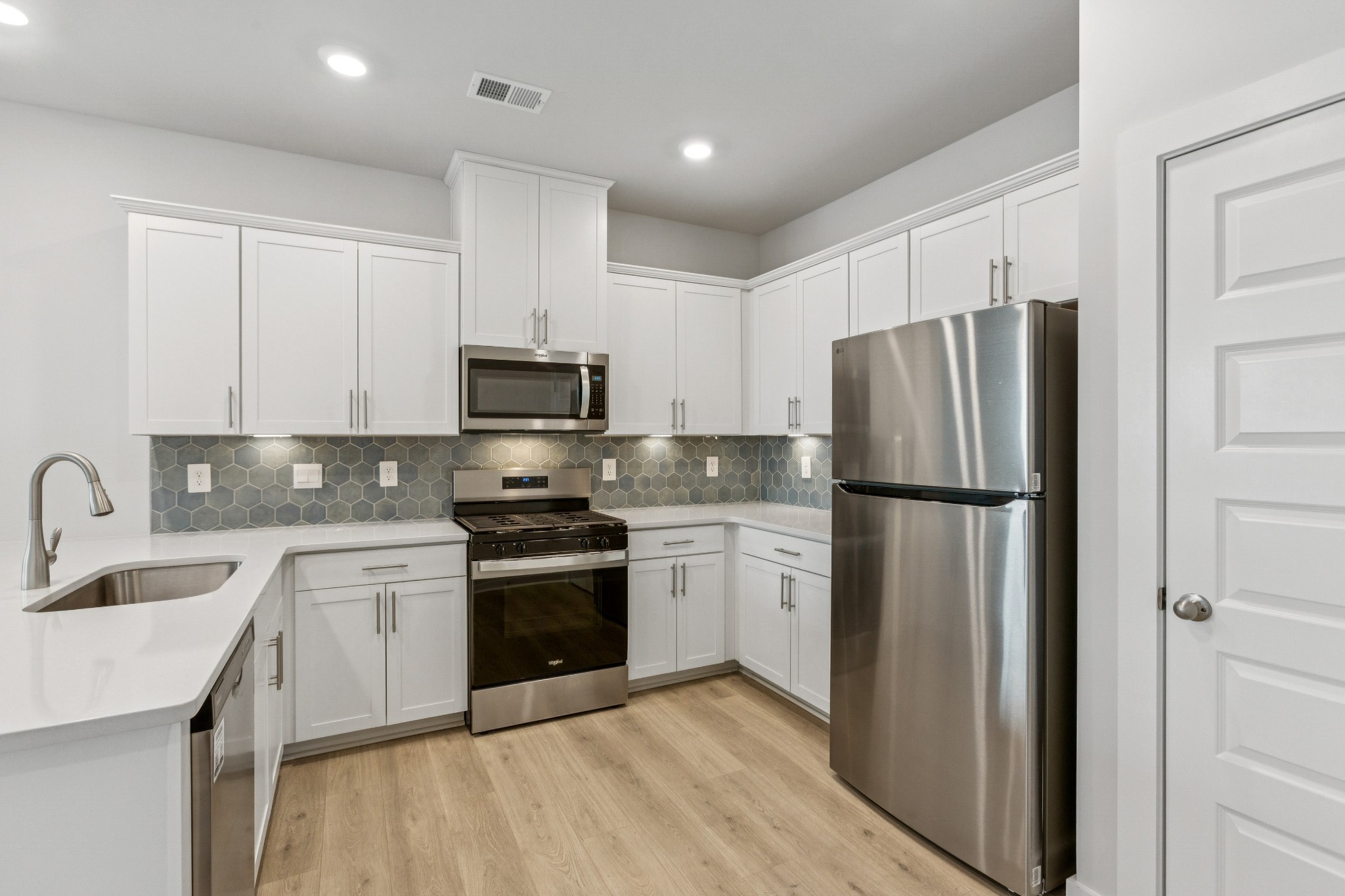 2069 Holmesburg Private Circle Gallatin, TN 37066 - Photo 4 of 16 a kitchen with a sink cabinets and stainless steel appliances