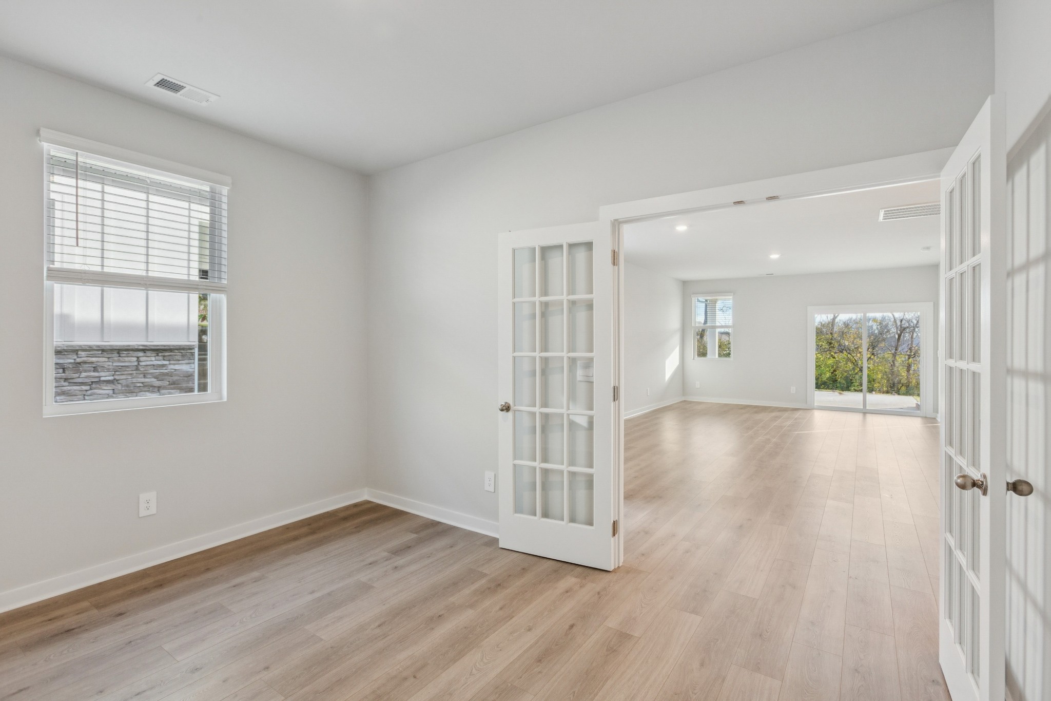 2069 Holmesburg Private Circle Gallatin, TN 37066 - Photo 5 of 16 an empty room with wooden floor and windows
