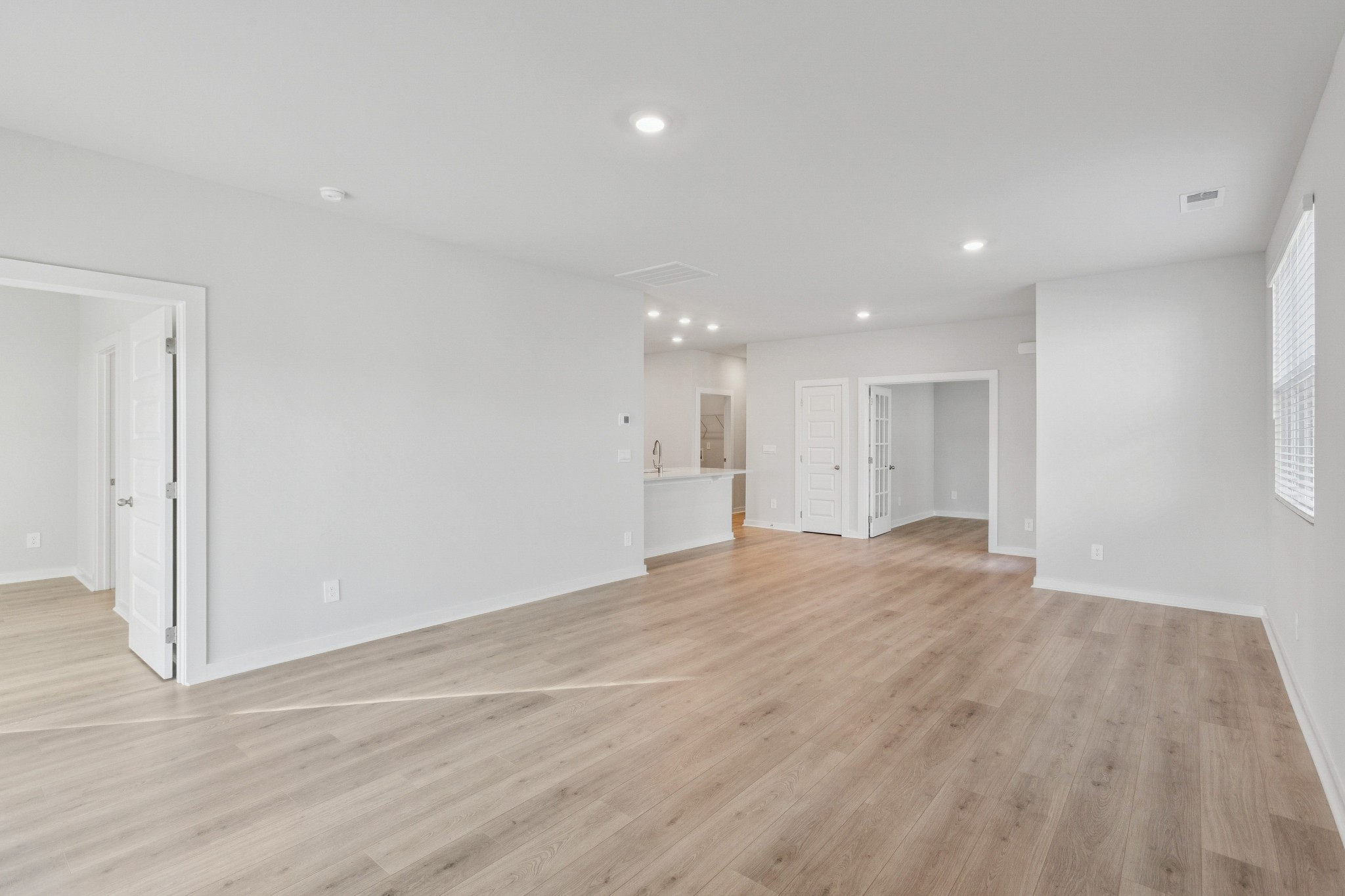 2069 Holmesburg Private Circle Gallatin, TN 37066 - Photo 6 of 16 a view of an empty room with wooden floor