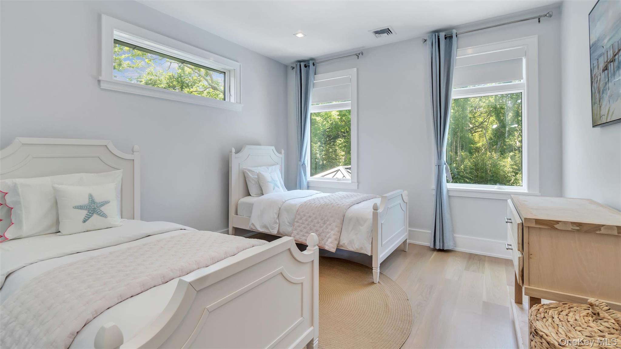 37 Wakeman Road Hampton Bays, NY 11946 - Photo 11 of 23 a bedroom with a bed and a window