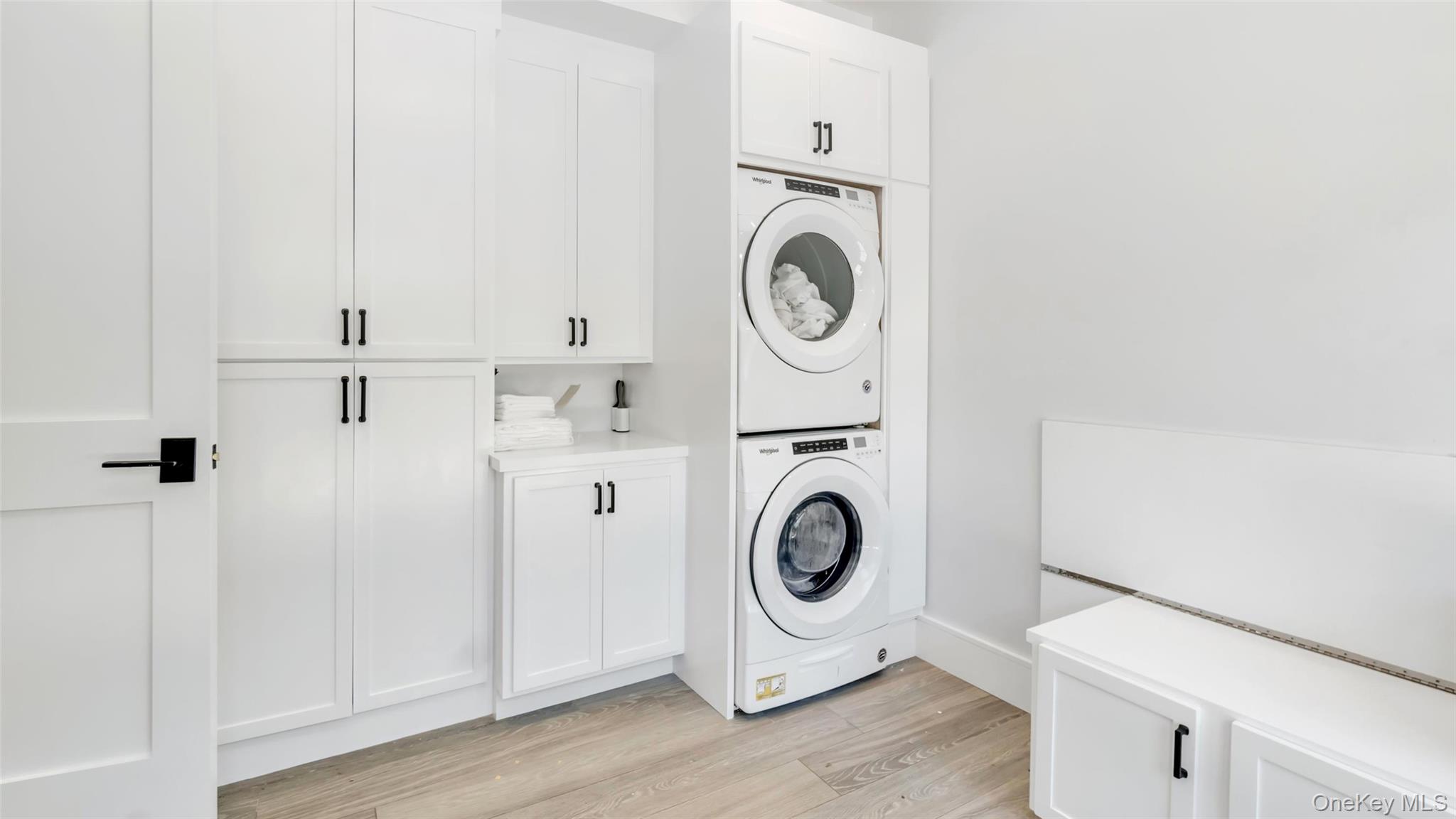 37 Wakeman Road Hampton Bays, NY 11946 - Photo 17 of 23 a utility room with dryer and washer
