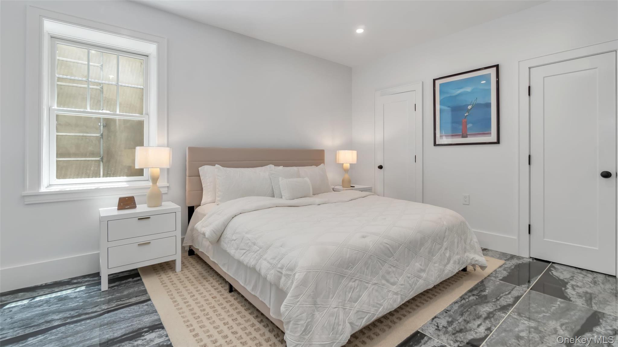 37 Wakeman Road Hampton Bays, NY 11946 - Photo 18 of 23 a bedroom with a bed and a window