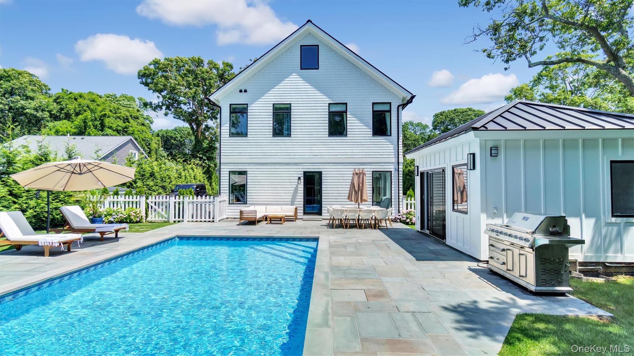37 Wakeman Road Hampton Bays, NY 11946 - Photo 22 of 23 a view of a house with furniture and a yard