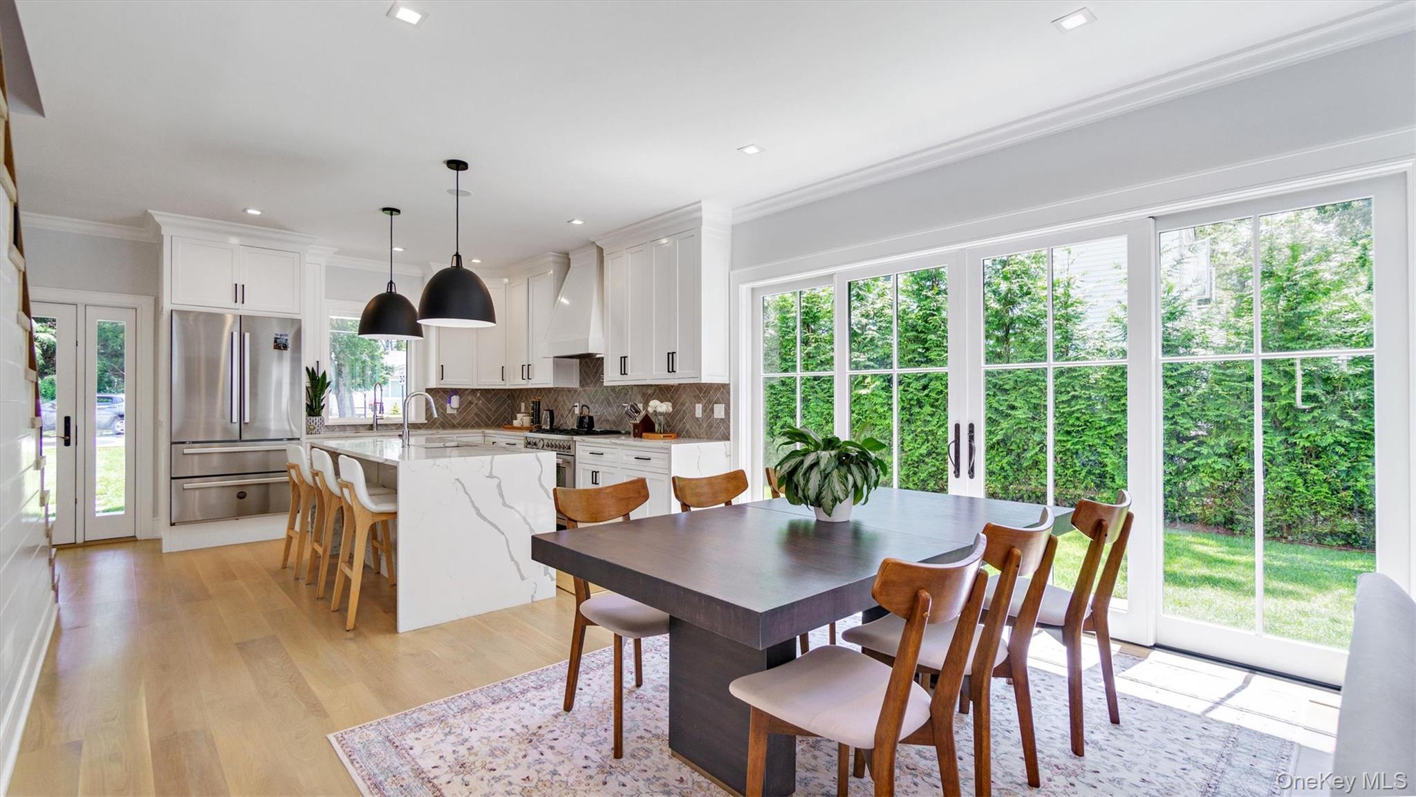 37 Wakeman Road Hampton Bays, NY 11946 - Photo 5 of 23 a view of a dining room with furniture window and outside view