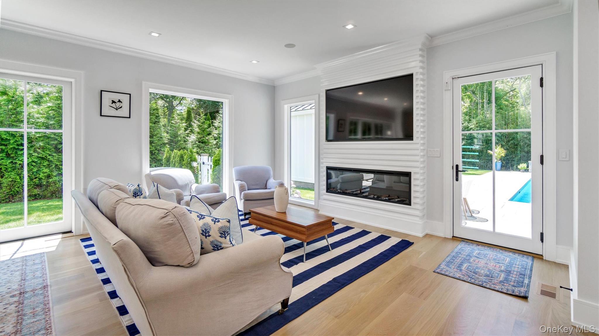 37 Wakeman Road Hampton Bays, NY 11946 - Photo 6 of 23 a living room with furniture and a flat screen tv
