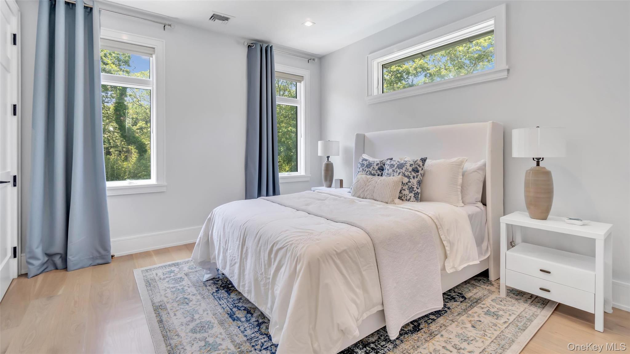37 Wakeman Road Hampton Bays, NY 11946 - Photo 10 of 23 a bedroom with a bed and a window
