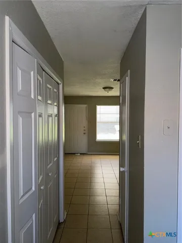 a kitchen with a refrigerator sink and stove