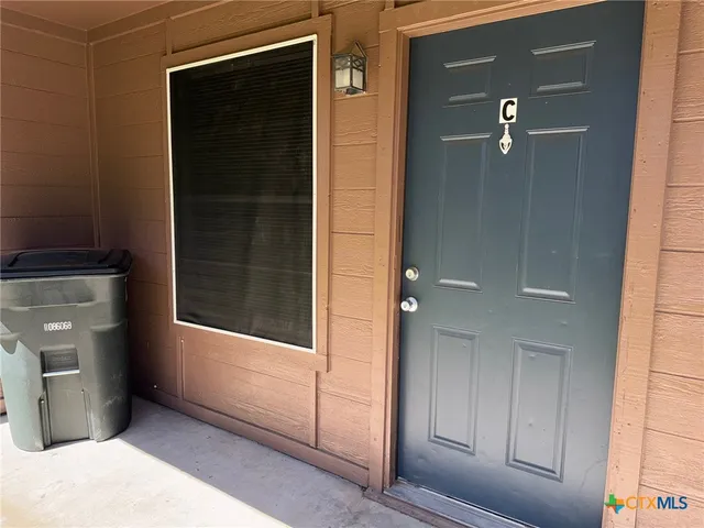 a view of a utility room and empty room