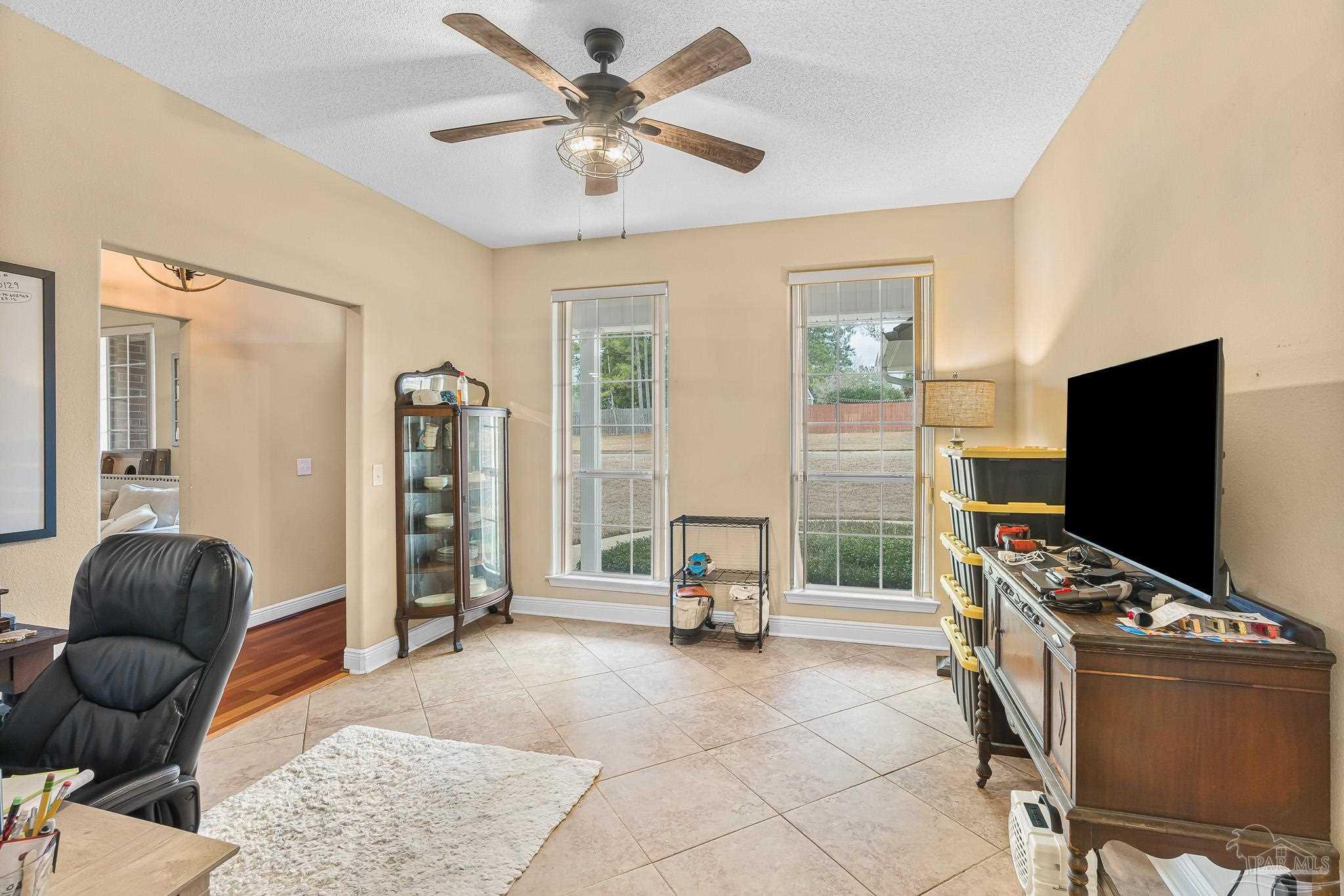 1089 Yellowstone Pass Cantonment, FL 32533 - Photo 14 of 45 a living room with furniture and a flat screen tv