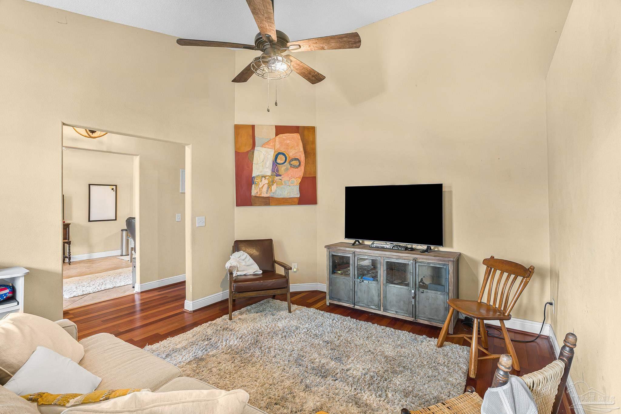 1089 Yellowstone Pass Cantonment, FL 32533 - Photo 15 of 45 a living room with furniture and a flat screen tv