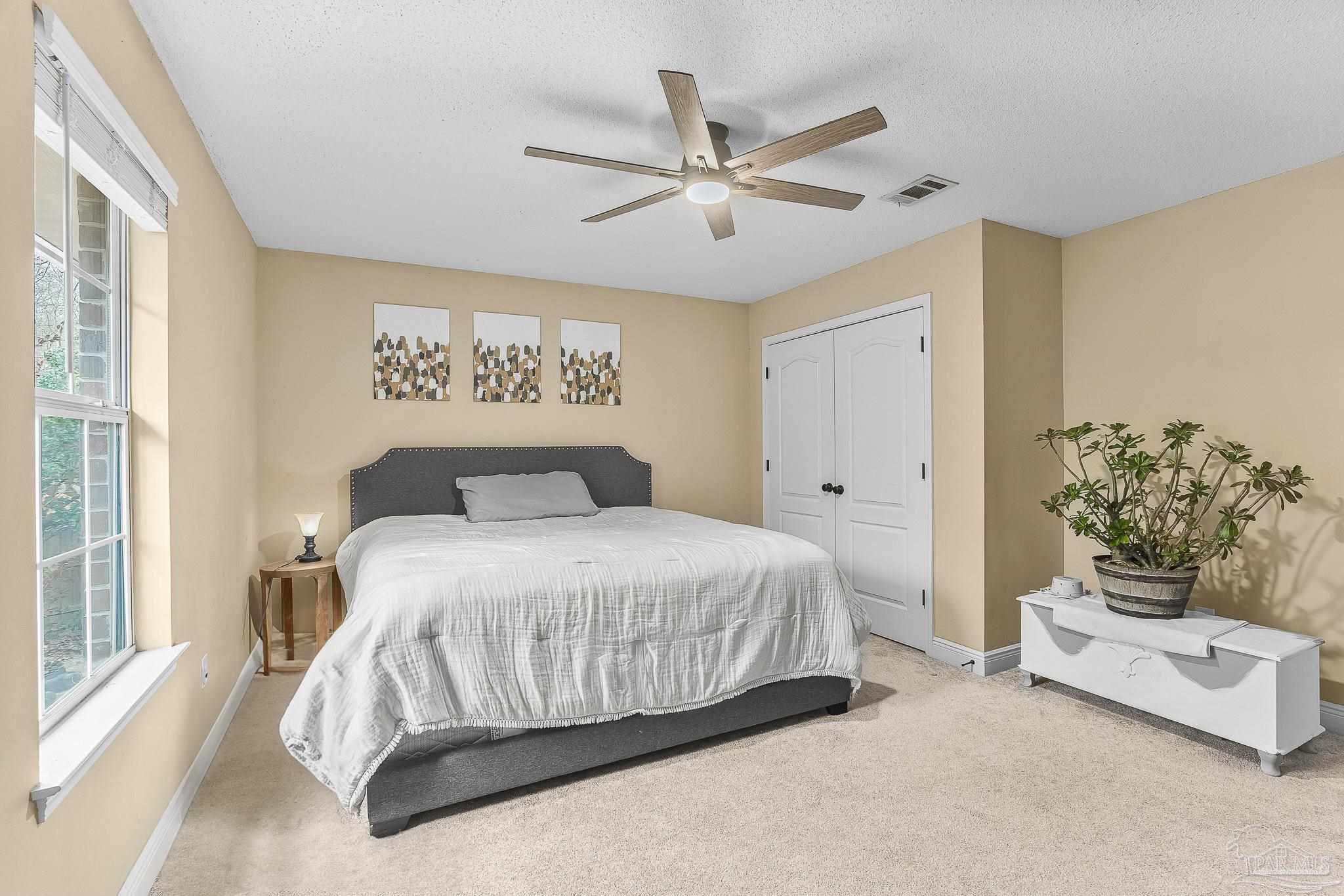1089 Yellowstone Pass Cantonment, FL 32533 - Photo 26 of 45 a bedroom with a bed and a window