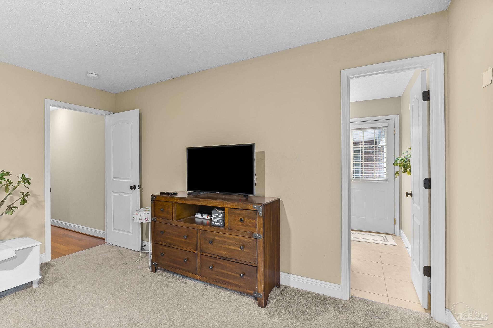 1089 Yellowstone Pass Cantonment, FL 32533 - Photo 28 of 45 a room with furniture and flat screen tv