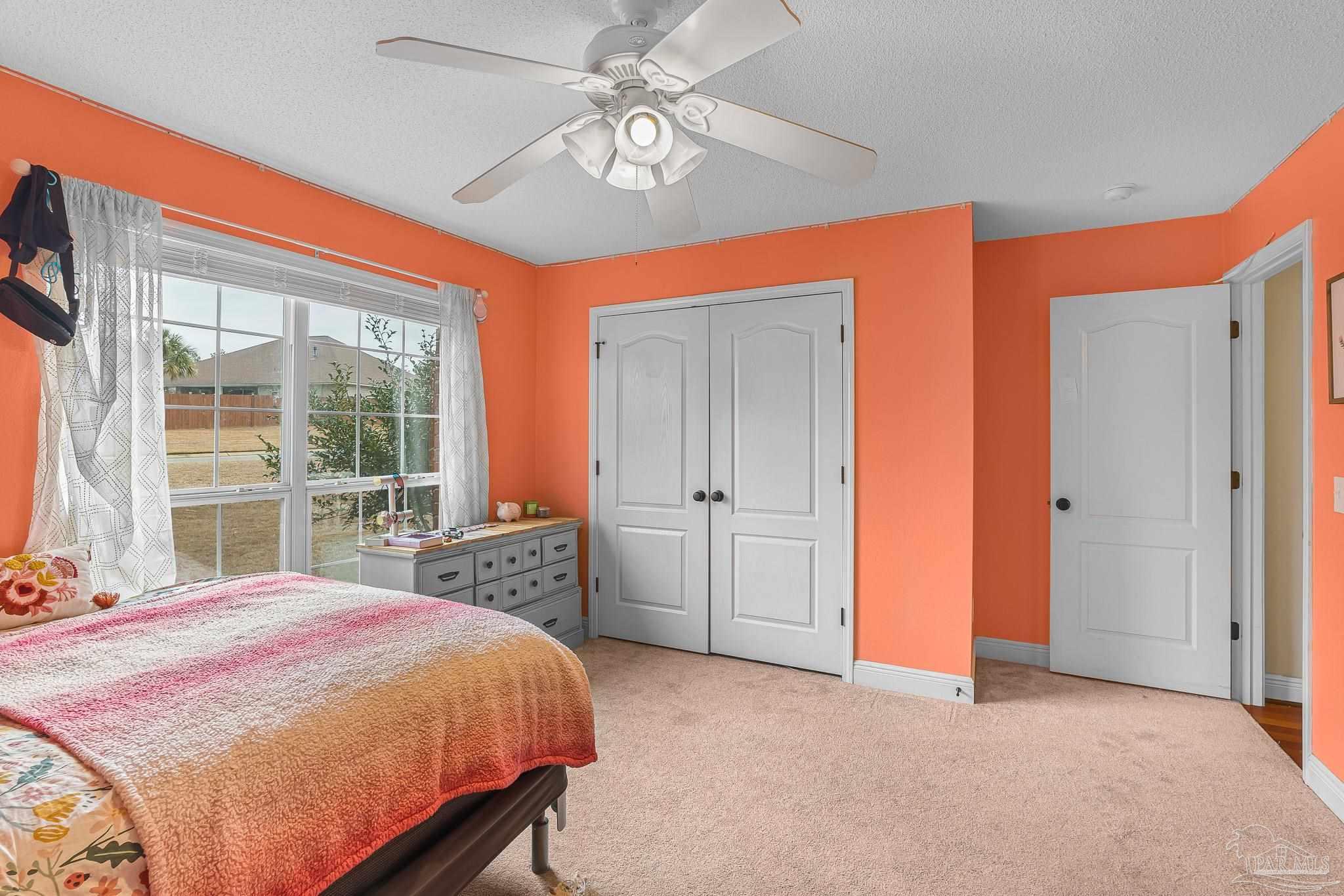 1089 Yellowstone Pass Cantonment, FL 32533 - Photo 30 of 45 a bedroom with a large bed and a large window