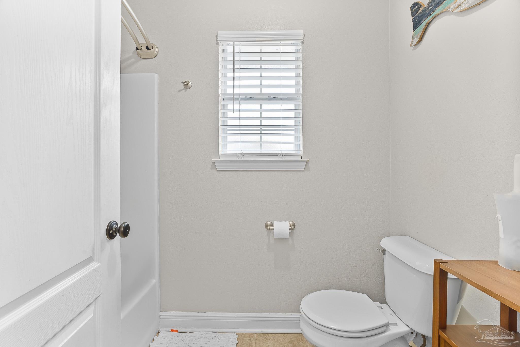 1089 Yellowstone Pass Cantonment, FL 32533 - Photo 34 of 45 a white toilet sitting next to a bath tub