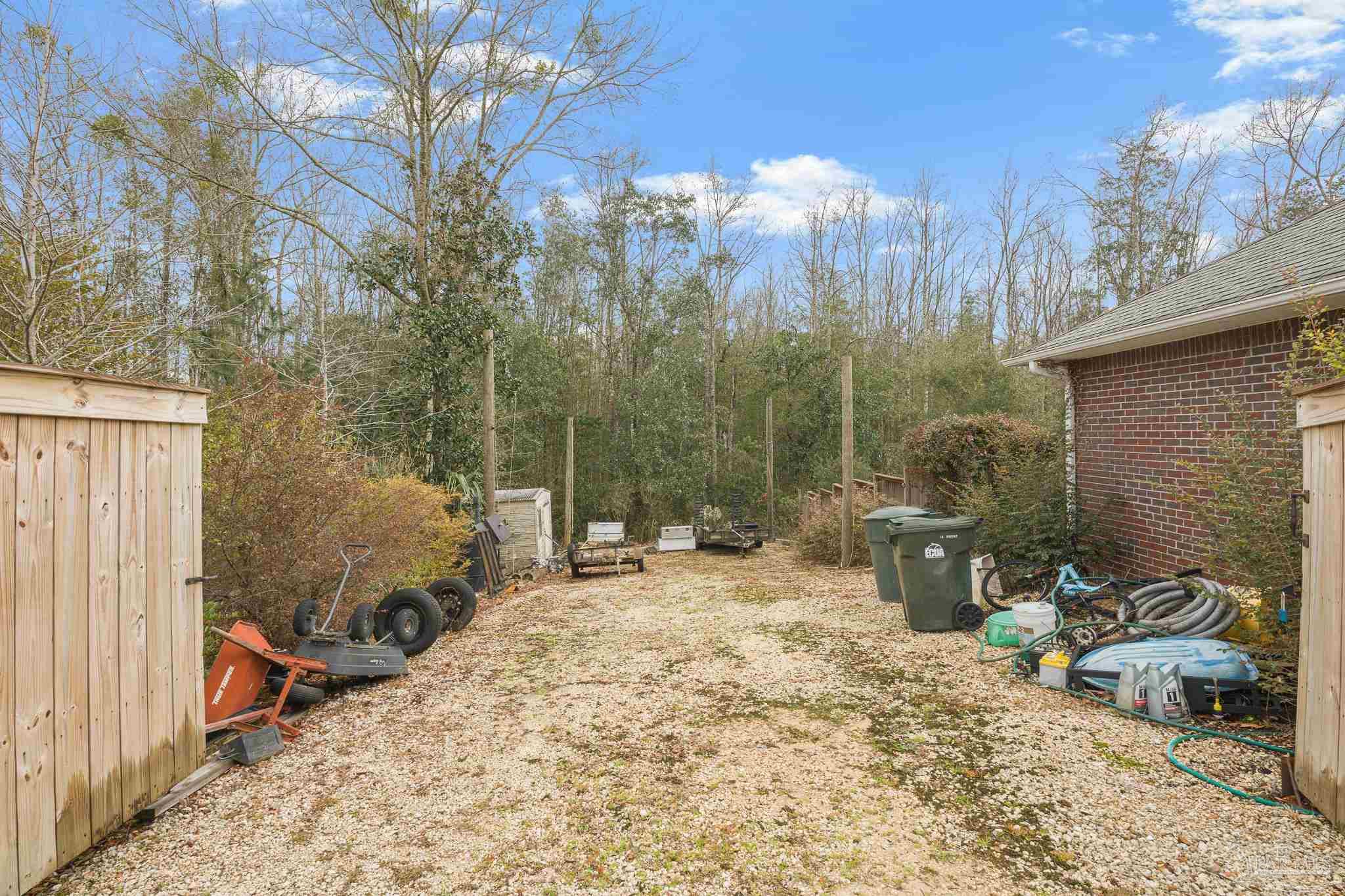 1089 Yellowstone Pass Cantonment, FL 32533 - Photo 39 of 45 a view of a backyard with sitting area and furniture