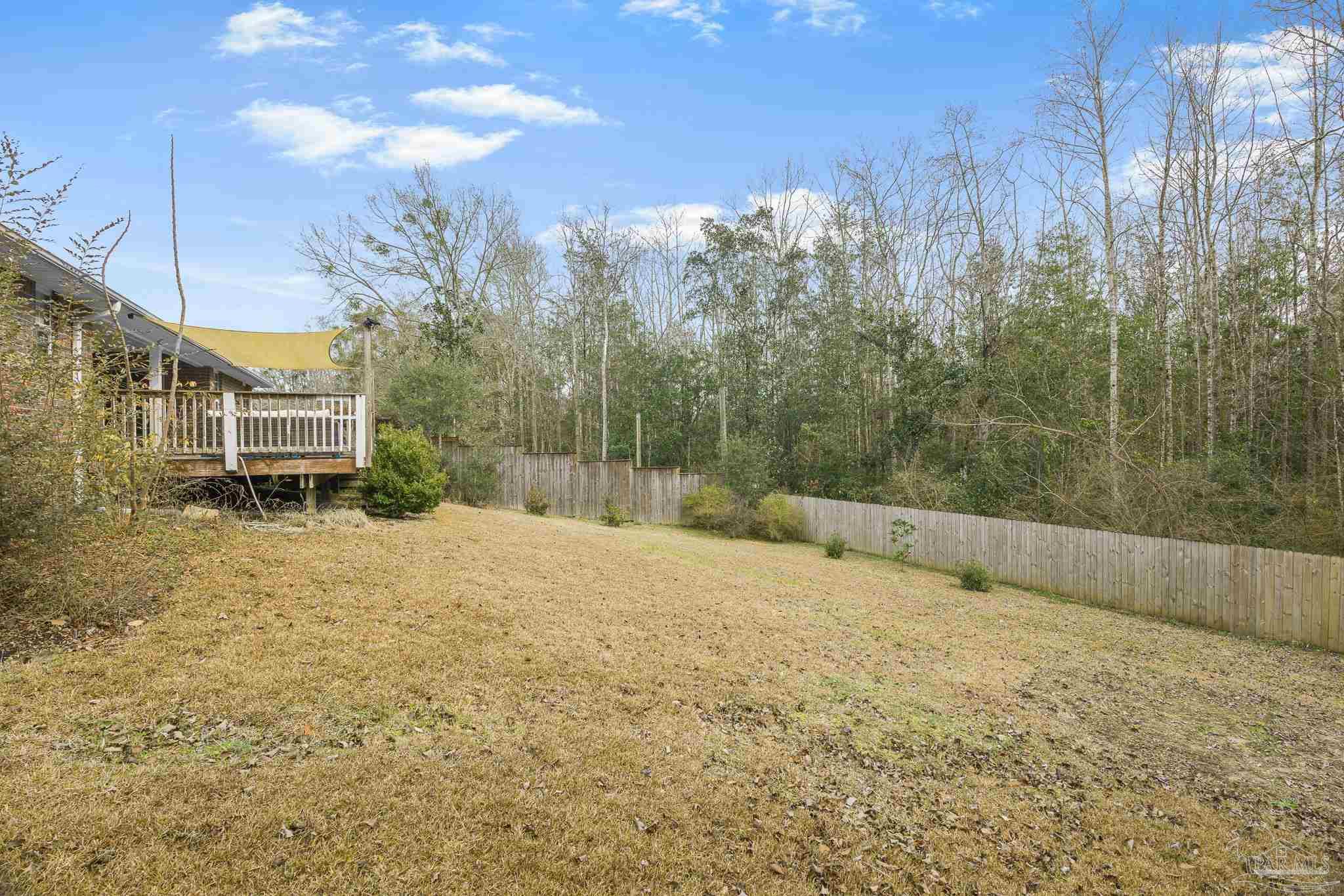 1089 Yellowstone Pass Cantonment, FL 32533 - Photo 41 of 45 a view of a yard with wooden fence