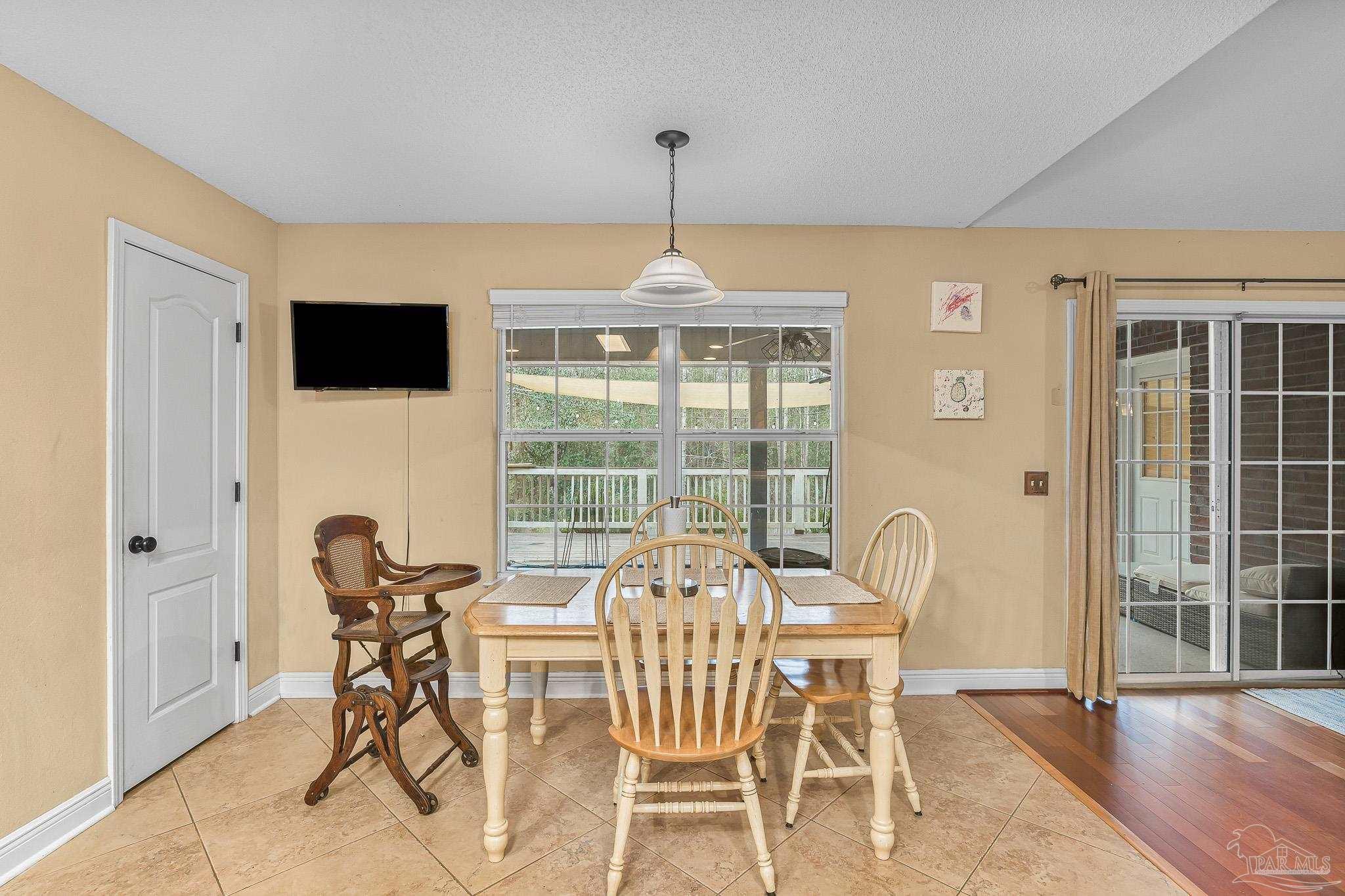 1089 Yellowstone Pass Cantonment, FL 32533 - Photo 8 of 45 a dining room with furniture and window