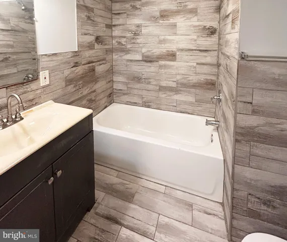 a bathroom with a sink and a bathtub