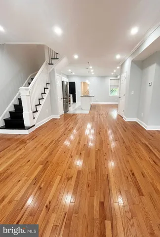 a spacious bathroom with a sink and a mirror
