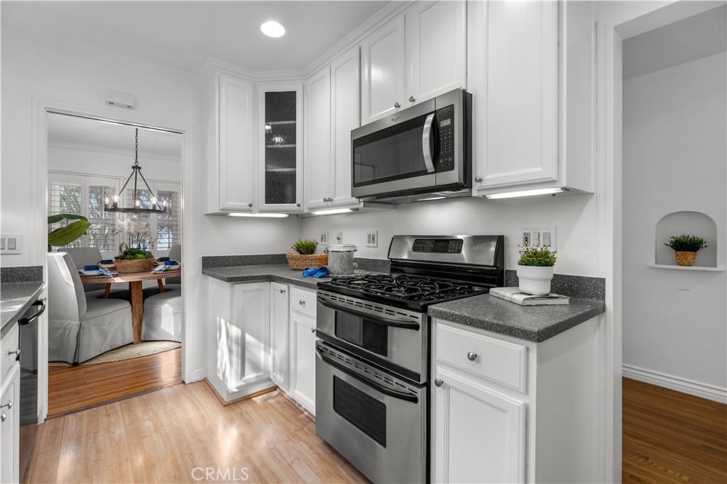 208 West Walnut Avenue El Segundo, CA 90245 - Photo 12 of 38 a kitchen with stainless steel appliances granite countertop a stove a sink and a microwave