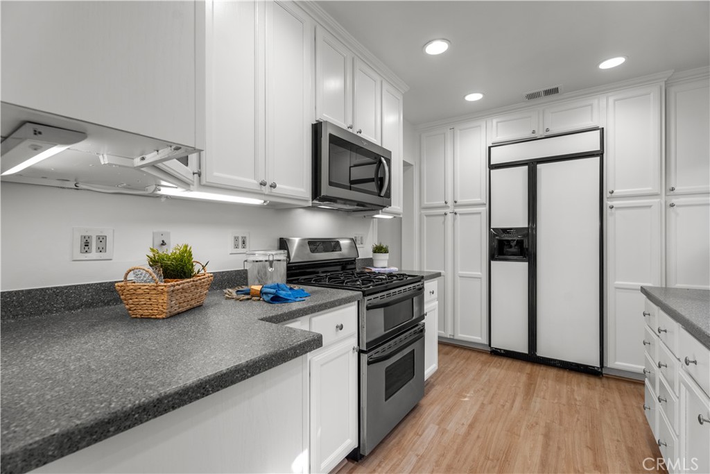 208 West Walnut Avenue El Segundo, CA 90245 - Photo 13 of 38 a kitchen with stainless steel appliances granite countertop a sink a stove and a refrigerator