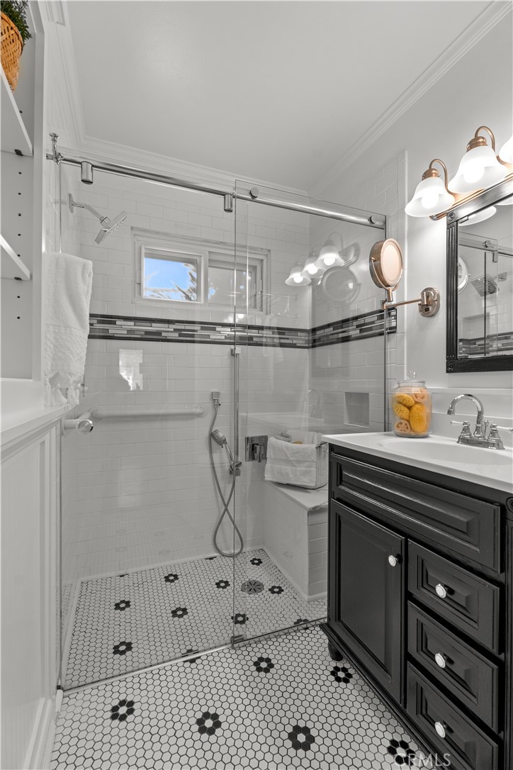 208 West Walnut Avenue El Segundo, CA 90245 - Photo 19 of 38 a bathroom with a sink a mirror and shower