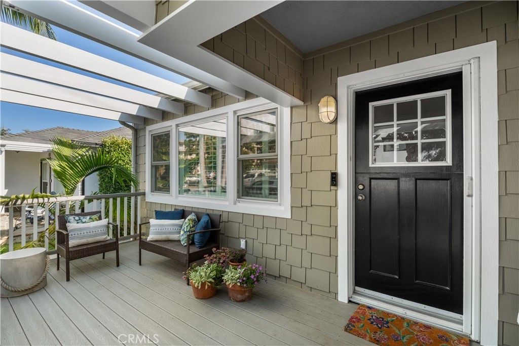 208 West Walnut Avenue El Segundo, CA 90245 - Photo 3 of 38 a view of a patio with table and chairs and wooden floor