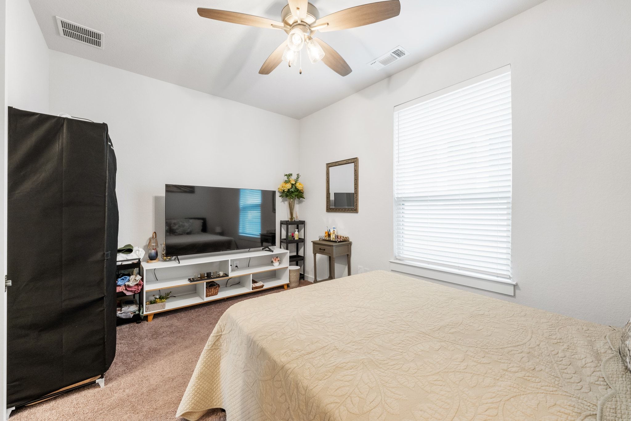 128 Three Oaks Lane Georgetown, TX 78628 - Photo 15 of 40 Bedroom with light carpet and a ceiling fan
