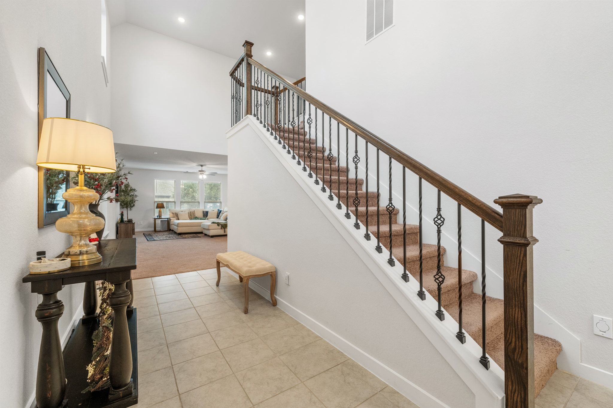 128 Three Oaks Lane Georgetown, TX 78628 - Photo 17 of 40 Stairway with tile patterned floors, a towering ceiling, and recessed lighting