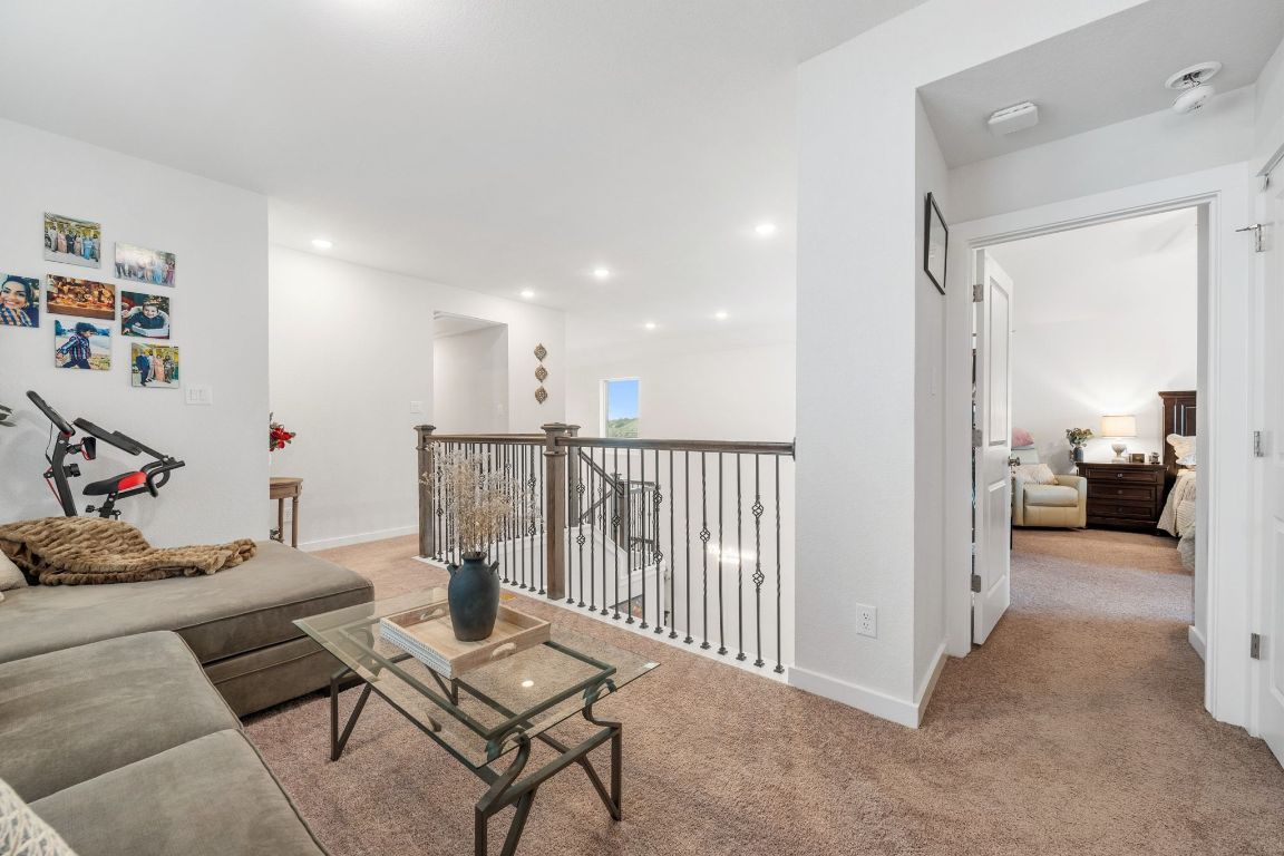 128 Three Oaks Lane Georgetown, TX 78628 - Photo 20 of 40 a living room with furniture and a flat screen tv