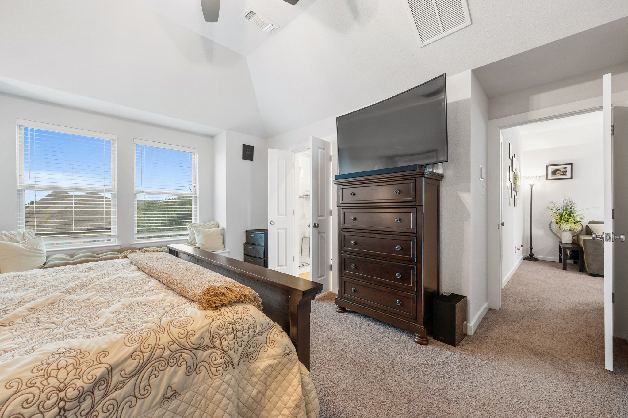 128 Three Oaks Lane Georgetown, TX 78628 - Photo 22 of 40 Bedroom with light colored carpet, ensuite bath, a ceiling fan, and vaulted ceiling
