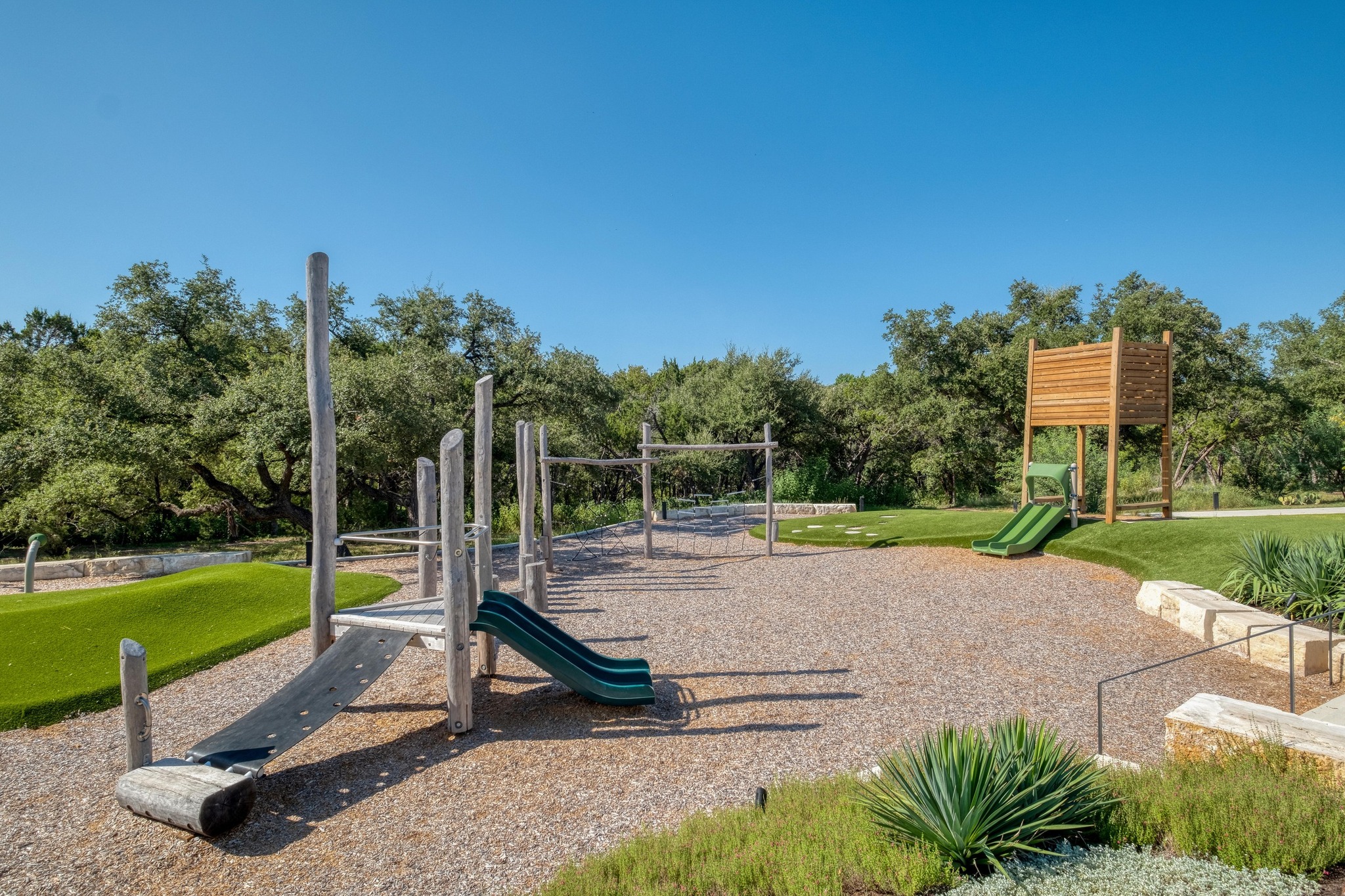 128 Three Oaks Lane Georgetown, TX 78628 - Photo 33 of 40 Community play area featuring a lawn and view of wooded area