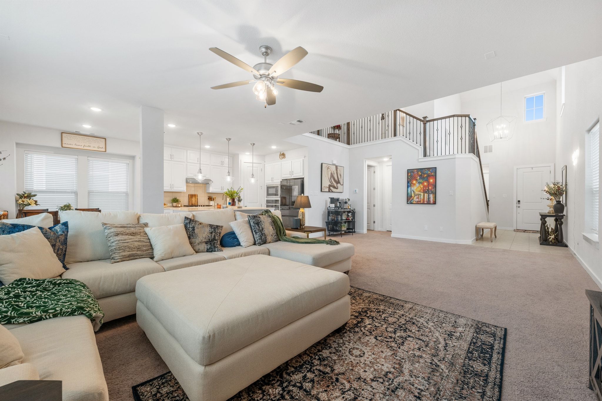 128 Three Oaks Lane Georgetown, TX 78628 - Photo 5 of 40 Carpeted living room featuring a ceiling fan, recessed lighting, and stairway