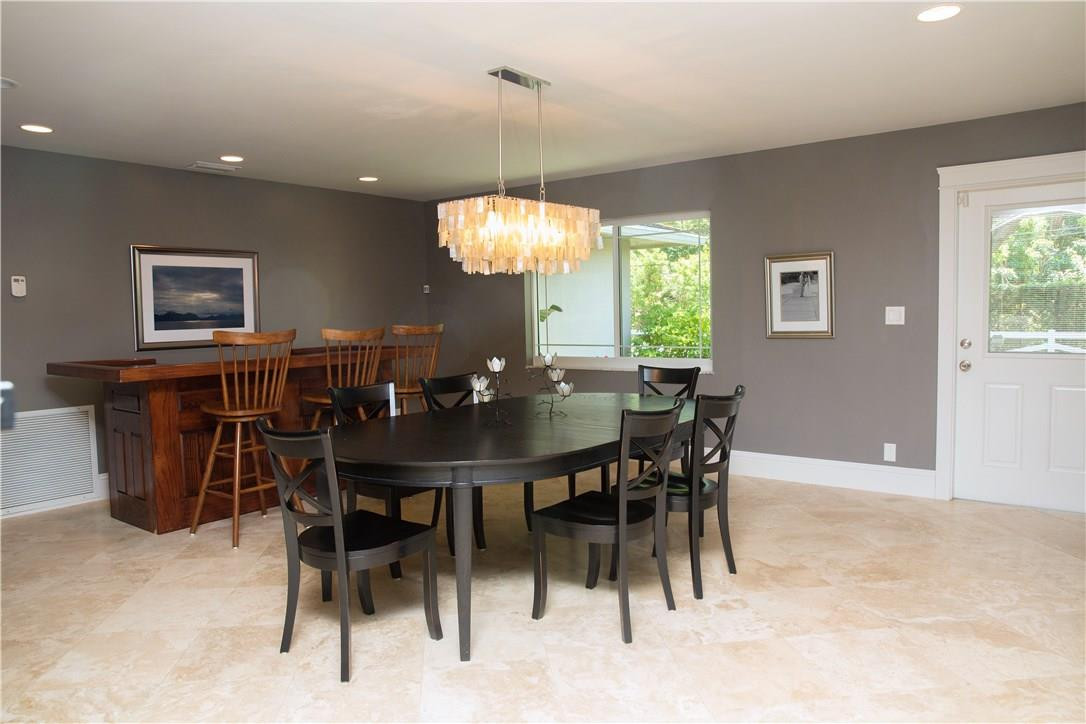 16800 Southwest 63rd Manor Southwest Ranches, FL 33331 - Photo 8 of 35 a view of a dining room with furniture and chandelier