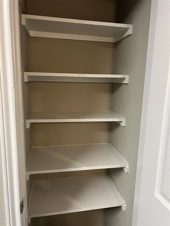 6108 Abrams Road, Unit 215 Dallas, TX 75231 - Photo 2 of 14 a view of walk in closet with empty racks