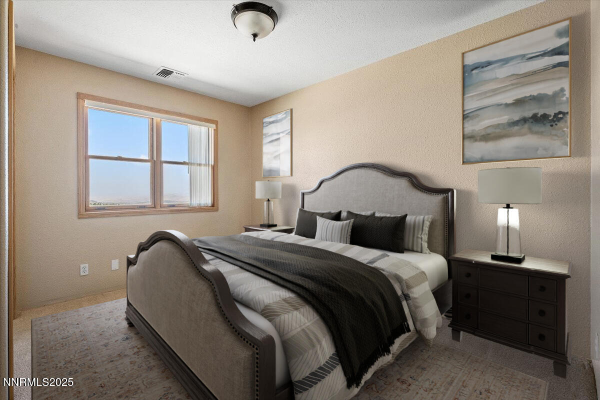 21470 Graves Road Reno, NV 89521 - Photo 15 of 37 a bedroom with bed and a window