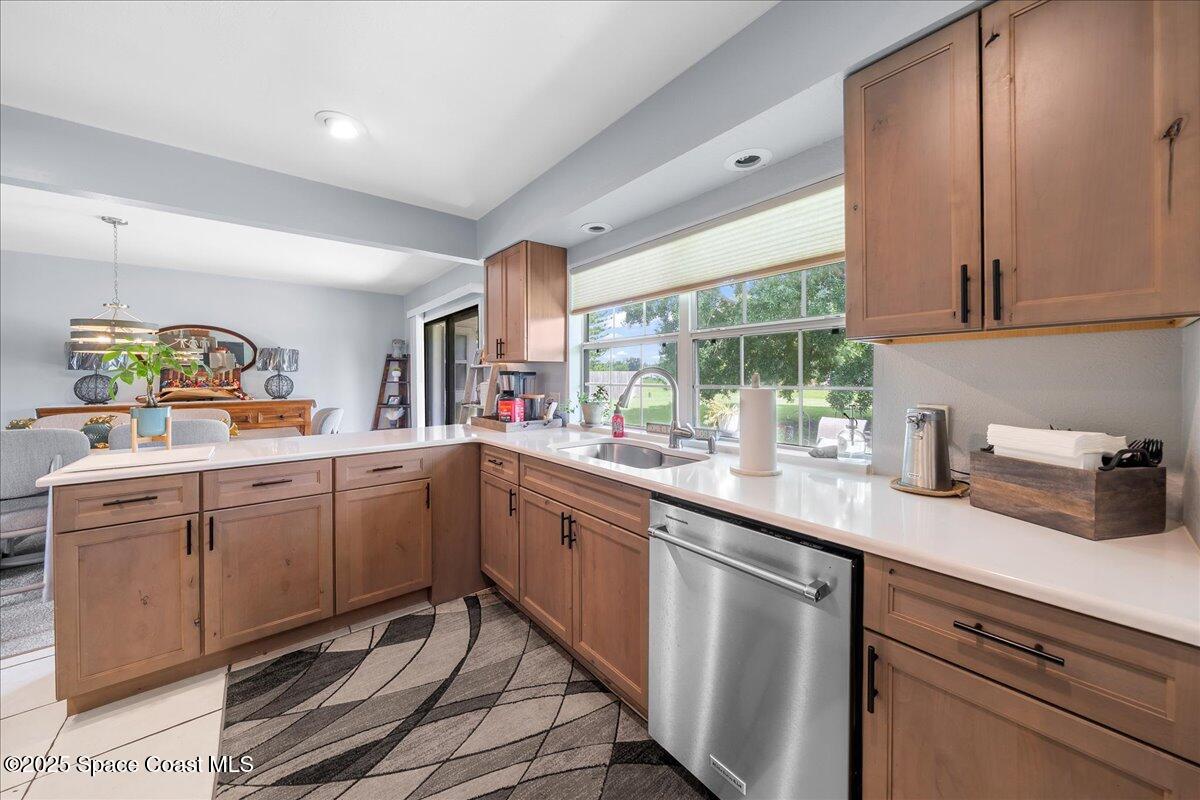 859 Riviera Drive Northeast Palm Bay, FL 32905 - Photo 11 of 26 a kitchen with sink cabinets and window