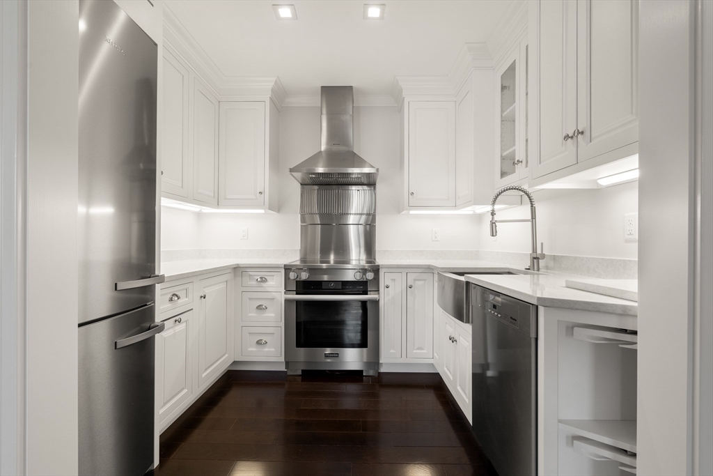 357-359 Beacon Street, Unit 4 Boston, MA 02116 - Photo 3 of 12 a kitchen with stainless steel appliances granite countertop a sink stove and refrigerator