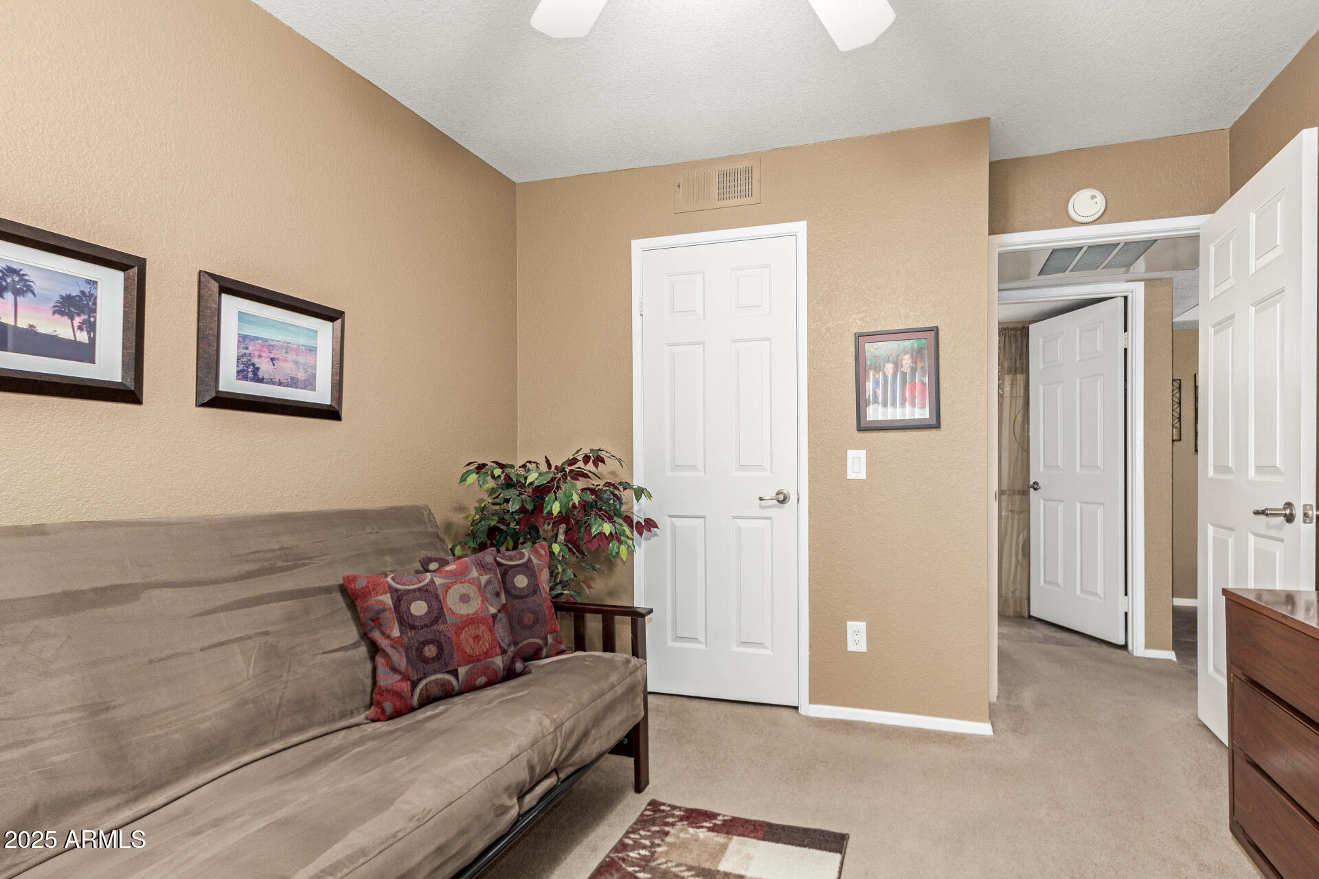 1720 East Thunderbird Road, Unit 2059 Phoenix, AZ 85022 - Photo 11 of 24 a living room with furniture and a potted plant
