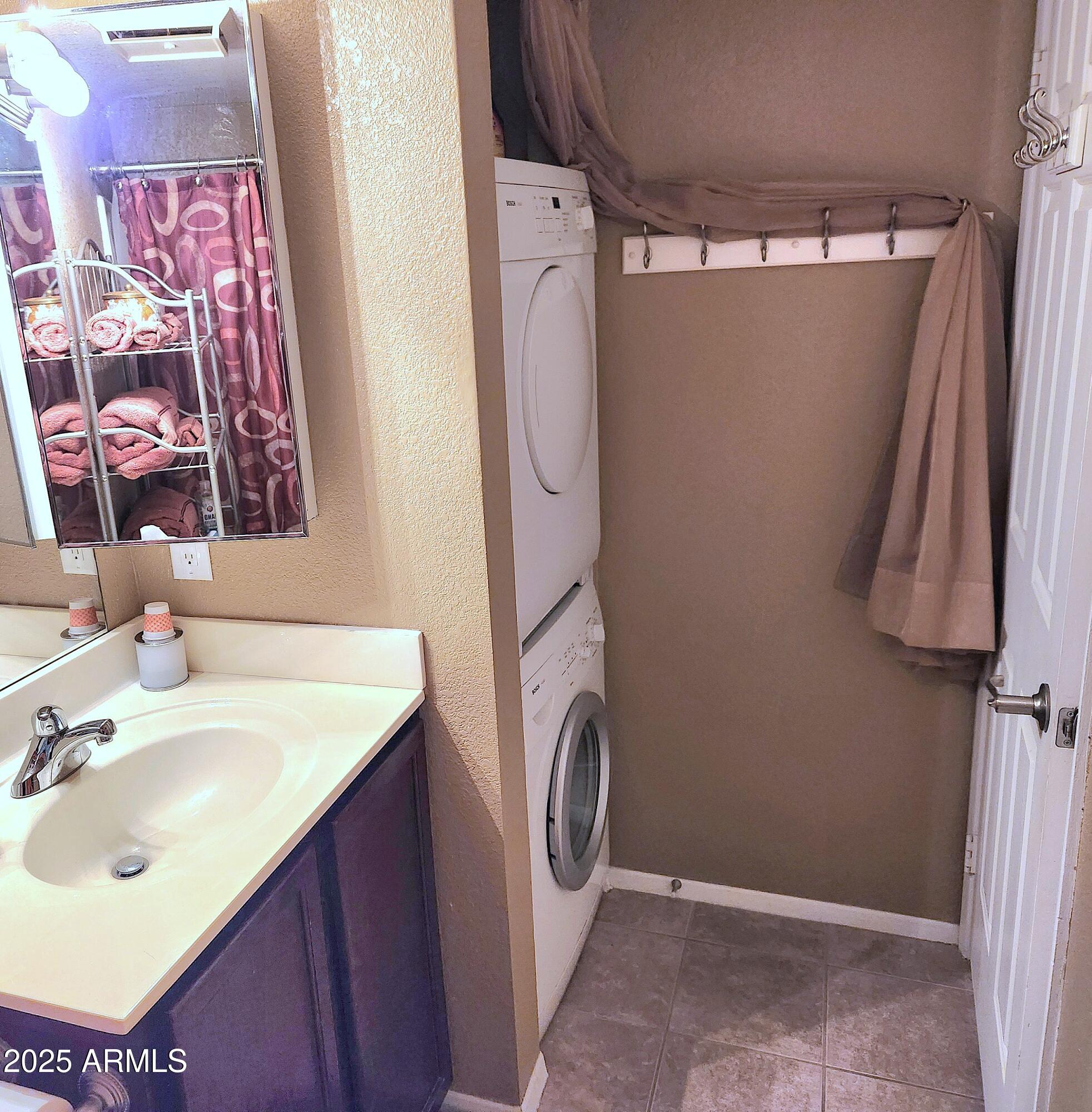 1720 East Thunderbird Road, Unit 2059 Phoenix, AZ 85022 - Photo 13 of 24 a bathroom with a sink vanity and mirror