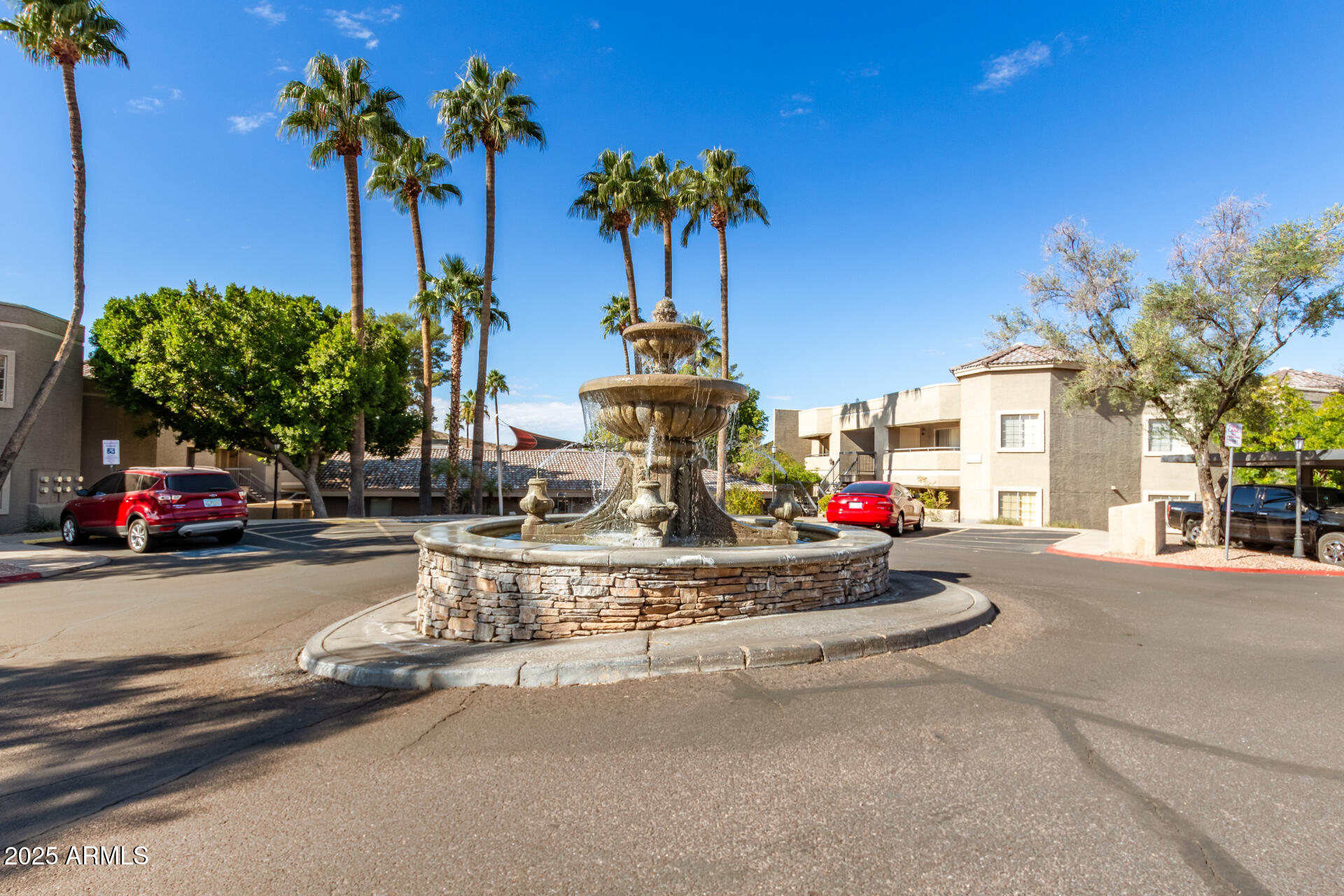 1720 East Thunderbird Road, Unit 2059 Phoenix, AZ 85022 - Photo 18 of 24 a front view of a house with fountain