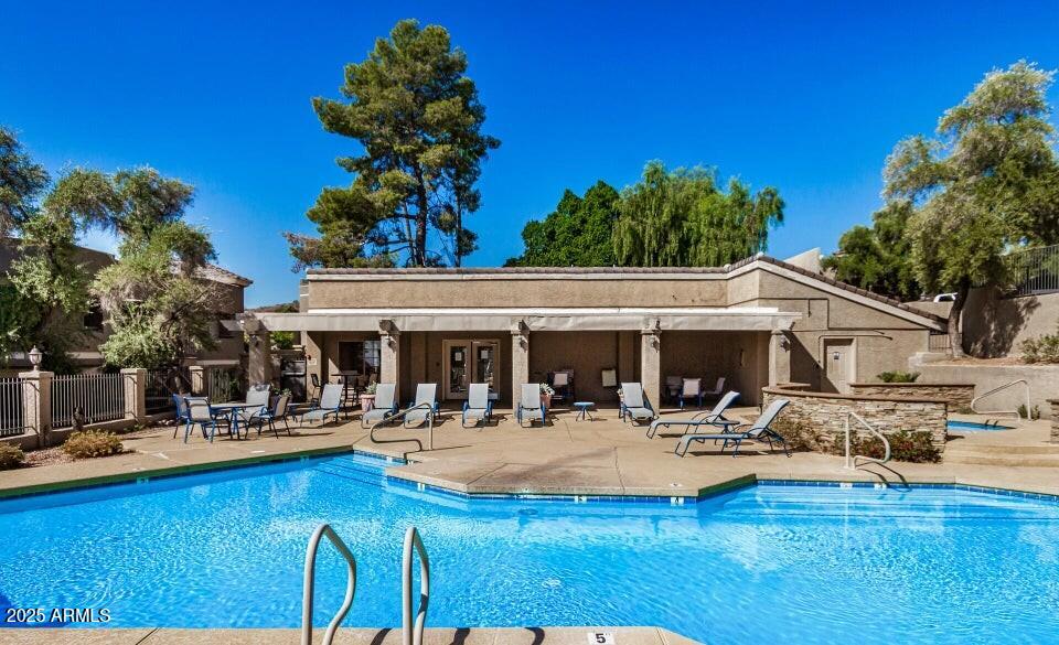 1720 East Thunderbird Road, Unit 2059 Phoenix, AZ 85022 - Photo 19 of 24 a view of a swimming pool with a patio