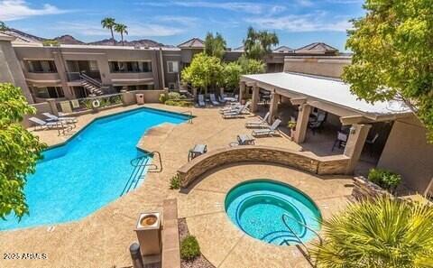 1720 East Thunderbird Road, Unit 2059 Phoenix, AZ 85022 - Photo 20 of 24 a view of a house with swimming pool and furniture