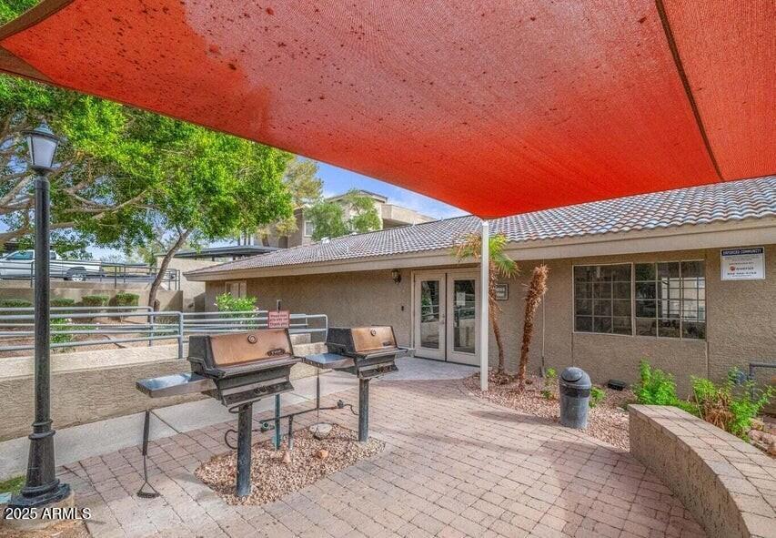 1720 East Thunderbird Road, Unit 2059 Phoenix, AZ 85022 - Photo 21 of 24 a view of a house with backyard and sitting area